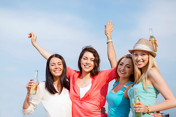 Image showing girls with drinks on the beach