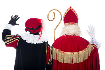 Image showing Sinterklaas and Black Pete from the back