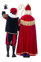 Image showing Sinterklaas and Black Pete from the back