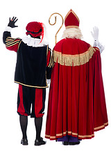 Image showing Sinterklaas and Black Pete from the back