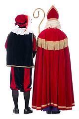 Image showing Sinterklaas and Black Pete from the back