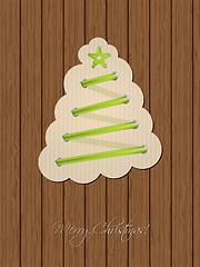 Image showing Christmas greeting with shoe lace tree and wooden background