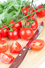 Image showing fresh tomatoes, rucola and old knife