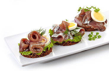 Image showing canapes with anchovies and egg