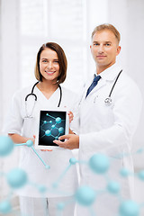 Image showing two doctors showing tablet pc with molecules