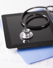 Image showing tablet pc, stethoscope and electrocardiogram