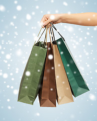 Image showing woman hands holding shopping bags