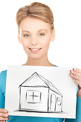 Image showing woman holding picture with house