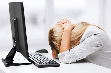 Image showing stressed woman with computer