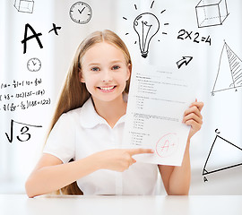 Image showing girl with test and A grade at school