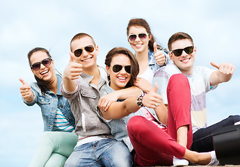 Image showing teenagers showing thumbs up