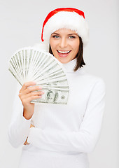 Image showing woman in santa helper hat with us dollar money