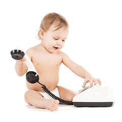 Image showing curious child playing with phone