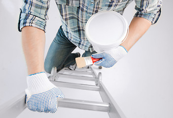 Image showing man with paintbrush and pot