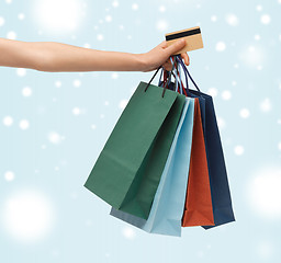 Image showing woman with shopping bags and credit card