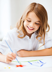 Image showing little girl painting at school