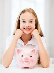 Image showing child with piggy bank