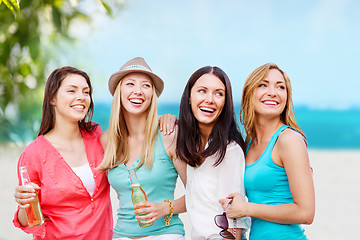 Image showing girls with drinks on the beach