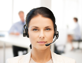 Image showing female helpline operator with headphones