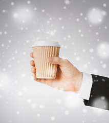 Image showing man hand holding take away coffee