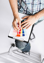 Image showing man with color samples for selection