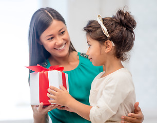 Image showing happy mother and child girl with gift box