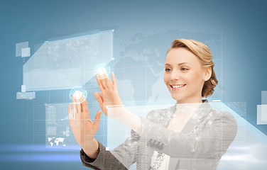 Image showing woman working with virtual screen