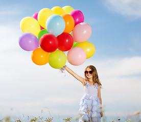 Image showing happy girl with colorful balloons