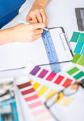 Image showing woman working with color samples for selection