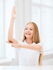 Image showing student girl with hand up at school