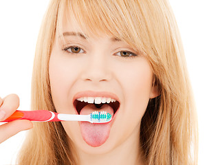 Image showing teenage girl with toothbrush