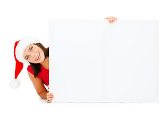 Image showing woman in santa helper hat with blank white board