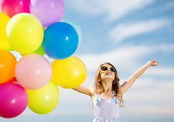 Image showing happy girl with colorful balloons