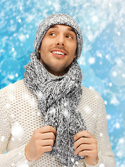 Image showing handsome man in warm sweater, hat and scarf