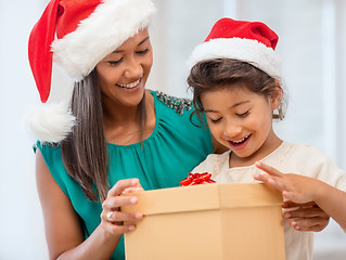 Image showing happy mother and child girl with gift box