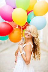 Image showing woman with colorful balloons