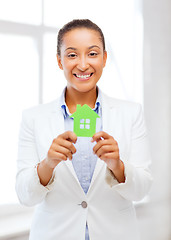 Image showing african woman holding green paper house