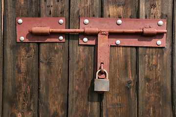 Image showing Old padlock on wooden door