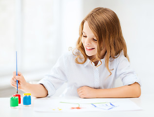 Image showing little girl painting at school
