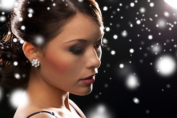 Image showing woman in evening dress wearing diamond earrings