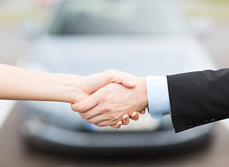 Image showing customer and salesman shaking hands