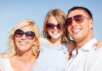 Image showing happy family with blue sky