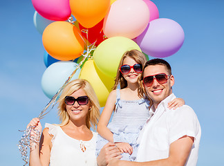 Image showing family with colorful balloons