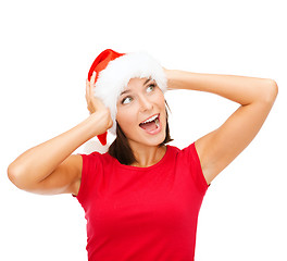 Image showing surprised woman in santa helper hat