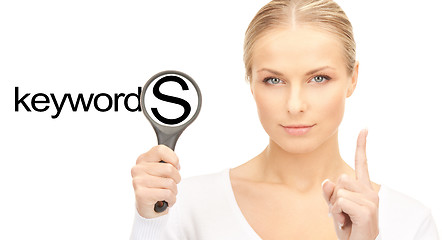 Image showing woman with magnifying glass and keywords word