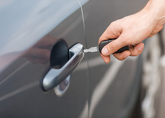 Image showing man with car key outside