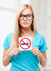 Image showing woman with smoking restriction sign