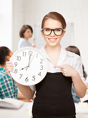 Image showing student showing clock