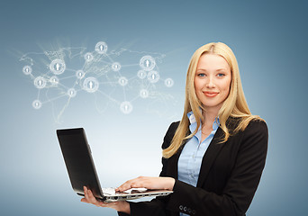 Image showing businesswoman with laptop and virtual screen