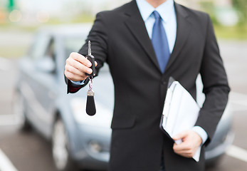 Image showing man with car key outside